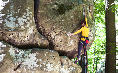 girl is climbing the rock.