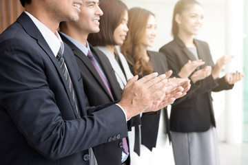 Business people  clapping their hands in the meeting