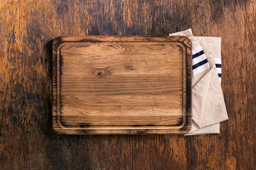 Old Cutting Board with cloth napkin on old wooden table