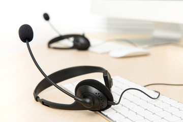 Microphone headsets on the table in call center