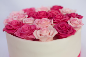 Pink marzipan roses on a cake