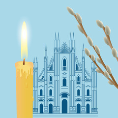 Burning candle near the cathedral with willow branches