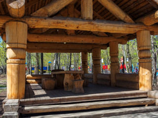 Arbor in a park of logs. Relax in the summer.