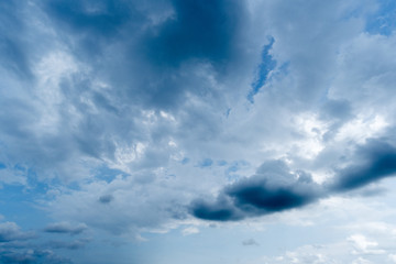 clouds with background,sunlight through very dark clouds background of dark storm clouds,black sky Background of dark clouds before a thunder.
