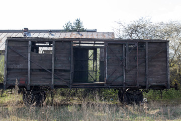 Fototapeta na wymiar Old wooden ruined boxcar