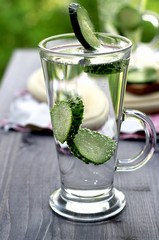 Cold drinking water with cucumber in a glass
