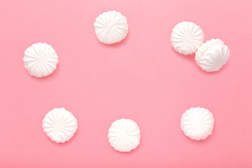Marshmallows on pink background. Zephyr on pink background.