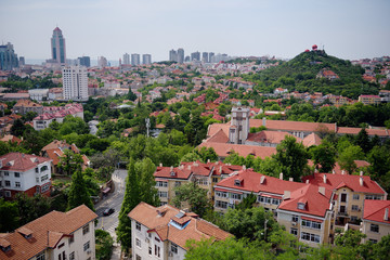 Fototapeta na wymiar Panorama on red tile roofs of houses