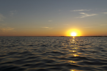 Breathtaking sunset in Danube Delta, Romania, in a summer day