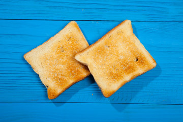 Toast on a wooden blue background