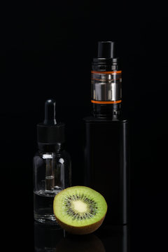 the concept of electronic cigarettes and kiwi on a dark background