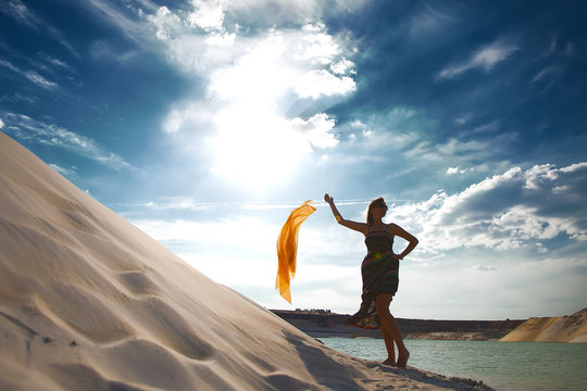 girl in desert near oasis