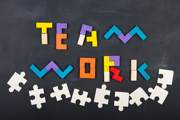 Teamwork creative concept concept jigsaw on the blackboard