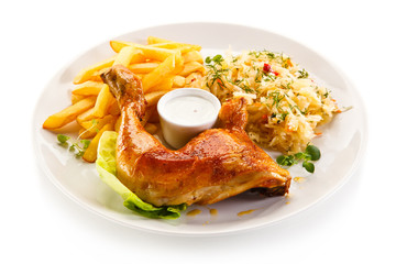 Roast chicken leg with french fries on white background