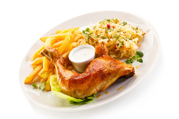Roast chicken leg with french fries on white background
