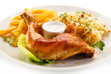 Roast chicken leg with french fries on white background