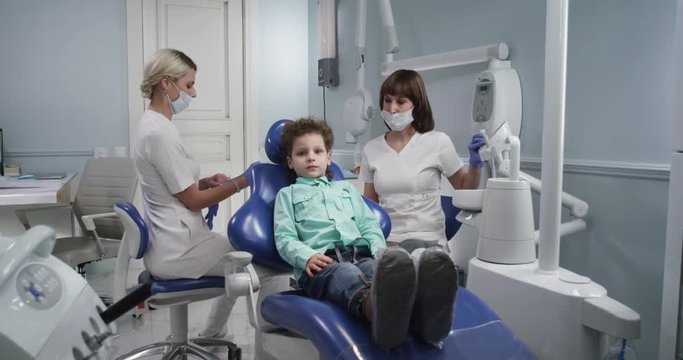The preparation of the child for examination by a doctor in a modern dental office