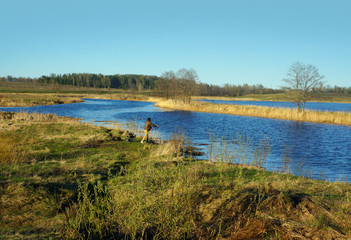 Fisherman on a coast of river