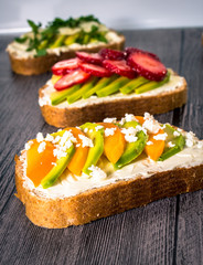 Variation of healthy rye breakfast sandwiches with avocado and with different ingredients