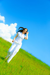 Woman Running On Green Meadow