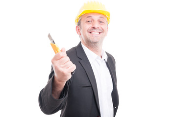 Portrait of contractor posing holding cutter and smiling
