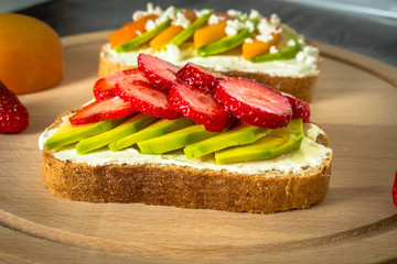 Variation of healthy rye breakfast sandwiches with avocado and with different ingredients