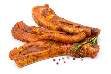 Spicy marinated spare ribs barbecued on the white background.