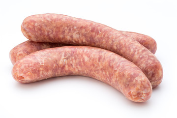 Raw sausage with parsley leaf isolated on white background.