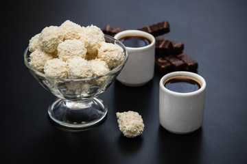 black coffee sweets on a black background