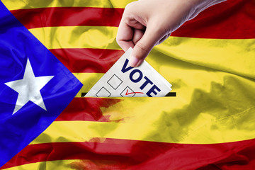Vote referendum for Catalonia independence exit national crisis separatism risk : close up hand of...