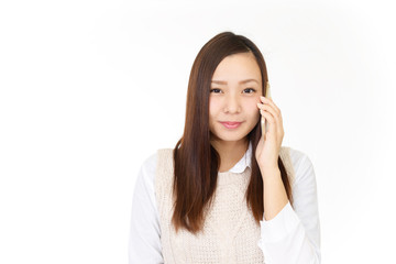 Fototapeta premium スマートフォンで通話中の女性