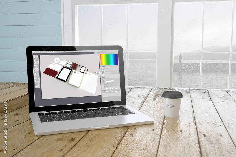 Wall mural laptop with branding design software on screen with port background and coffee