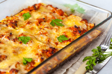 Traditional Italian meat lasagna baked in glass form.