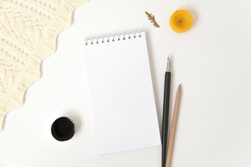 Mock up of paper notepad on white background. Top view.