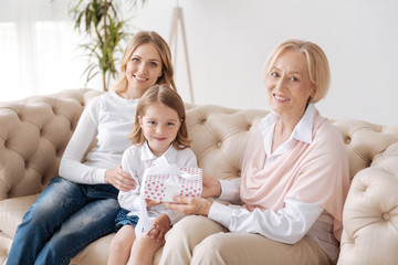 Loving grandmother congratulating her granddaughter