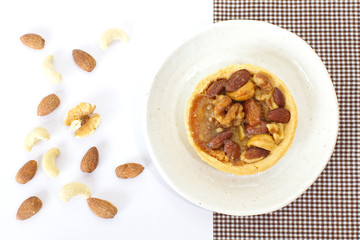 Mixed nuts and a baked dish tart