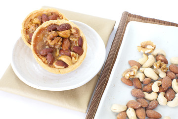 Mixed nuts and a baked dish tart