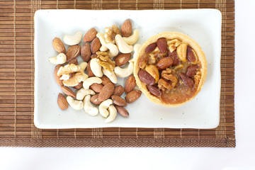 Mixed nuts and a baked dish tart