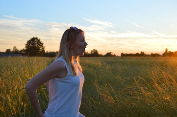 Young woman in the sunset