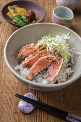 Traditional Japanese Hokkaidon  Thinly sliced Salmon Donburi as close-up in a bowl