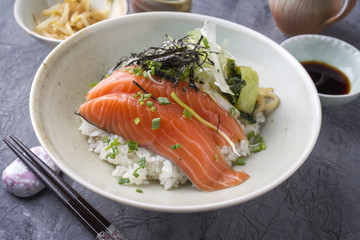 Traditional Japanese Hokkaidon Thinly sliced salmon Donburi as close-up in a bowl