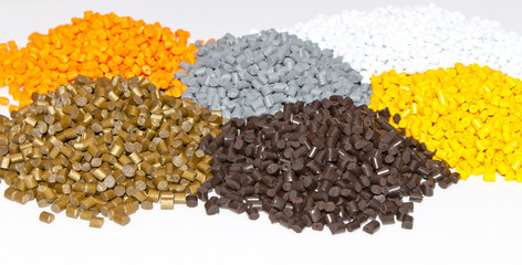 Plastic pellets on the table in the laboratory. Polymeric dye. Colorant for plastics in the...