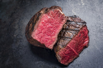 Barbecue Wagyu Point Steak very rare sliced as close-up on a slate