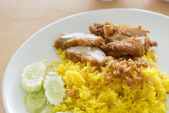 muslim yellow rice with chicken,halal food yellow rice with chicken leg