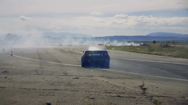 Racing car drifting the turn during a race