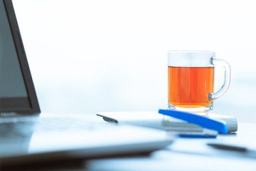 A cup of tea on a laptop