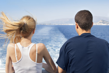 Fototapeta na wymiar Young Woman And Man On A Ship