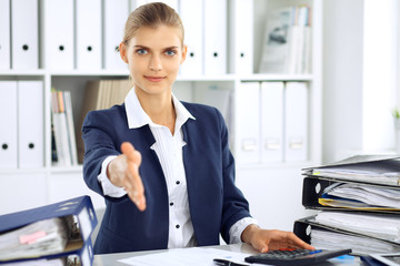 Modern business woman or confident female accountant offering helping hand