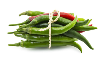 Chili peppers tied by rope on white background