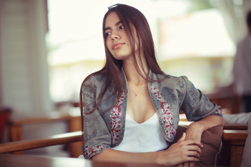 Summer portrait of a young adult beautiful girl